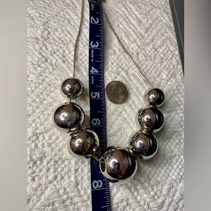 Large silver-toned bead Express necklace.